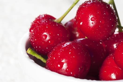 Sweet red cherries with drops of water
