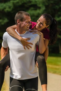 Close up portrait of man giving piggyback ride his girlfriend
