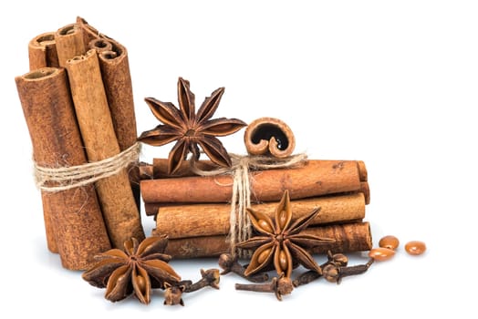 Cinnamon sticks and star anise isolated over a white background