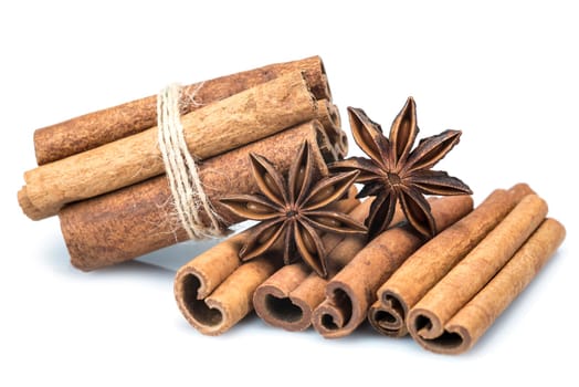 Cinnamon sticks and star anise isolated over a white background