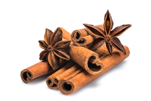 Cinnamon sticks and star anise isolated over a white background