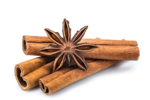 Cinnamon sticks and star anise isolated over a white background