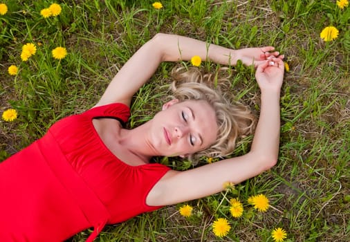 Woman sleeps on meadow