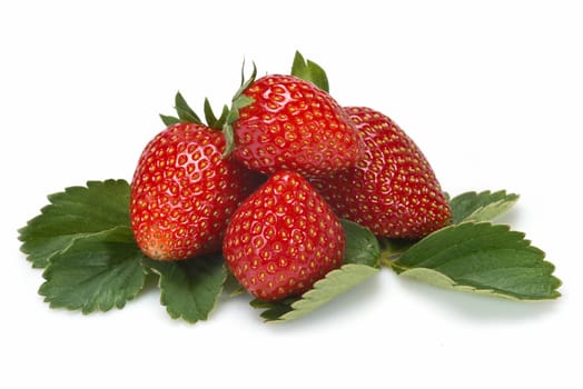 Strawberries with their leaves isolated on a white background