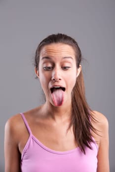 Funny pretty girl with the tongue stuck out