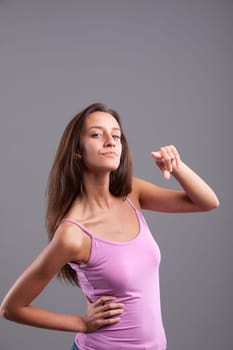 Serious girl pointing at you staring at the camera
