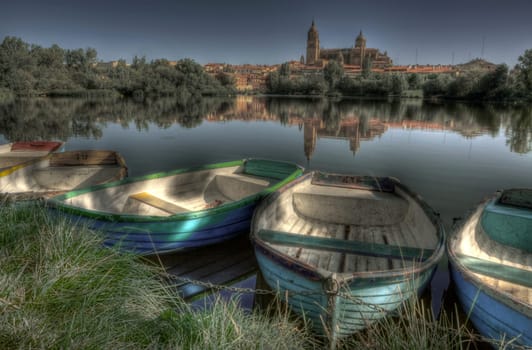 Dock of rawboats at Tormes river, in front of Salamanca of the Cathedral of Salamanca