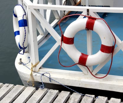 Lifebelts on the deck of a little ship.