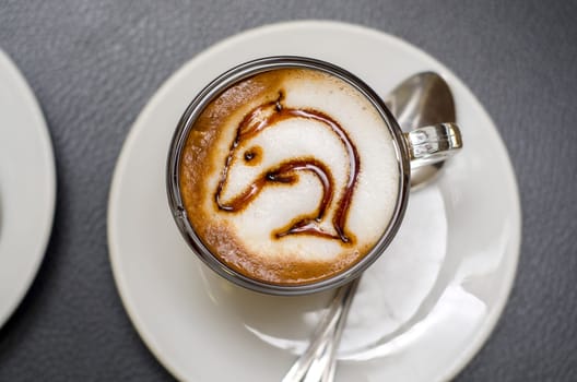 coffee decorated with a dolphin