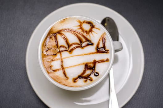 coffee decorated with an umbrella on the beach