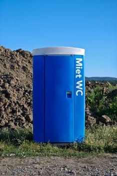 Blue mobile toilet