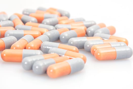 Orange and grey tablets close up