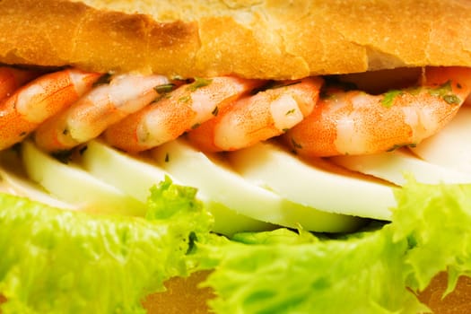 Baguette with shrimp,fast food decorated with salad and egg
