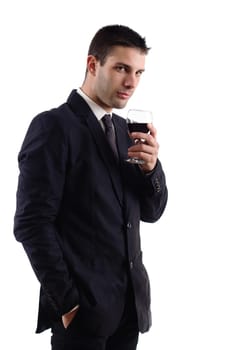 View of a young man holding a red glass of fine wine isolated on white studio background.