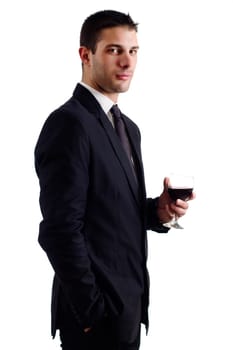 View of a young man holding a red glass of fine wine isolated on white studio background.