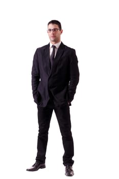 View of a young man with glasses on a dark business suit isolated on a white background.