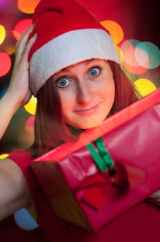 happy young woman opening gift box