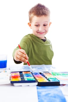 Casual schooboy painting with watercolor on white background