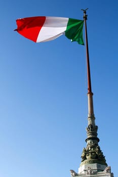 Italian flag in the wind in the Monument of Victor Emmanuel II, located in Rome, Italy