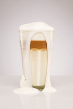 Exuberant latte macchiato on grey background