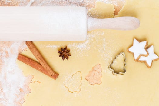 Baking for Christmas from above with dough cinnamon and anise