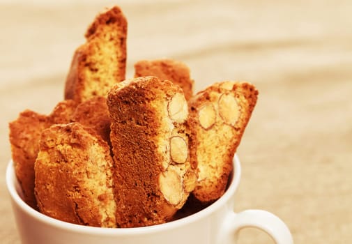 Close-up of cantuccini biscuits in a coffee cup