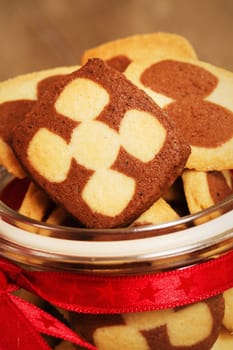 Close-up of Christmas cookies in a glass in warm light