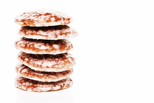 A stack of gingerbread for Christmas against a white background