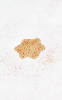 Star shape for Christmas in flour on wood