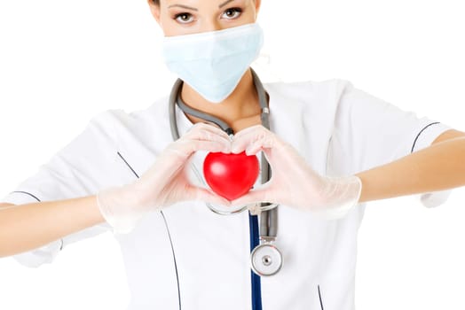Young nurse with heart in her hand , isolated on white.