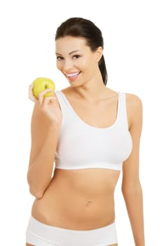 Beautiful woman with clean fresh healthy skin holding green apple. Isolated on white