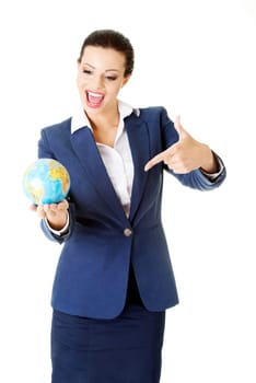 Young businesswoman holding globe, isolated on a white background