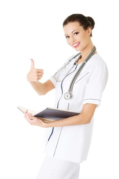 Attractive medicine student or doctor reading book ( treatise ), isoalted on white