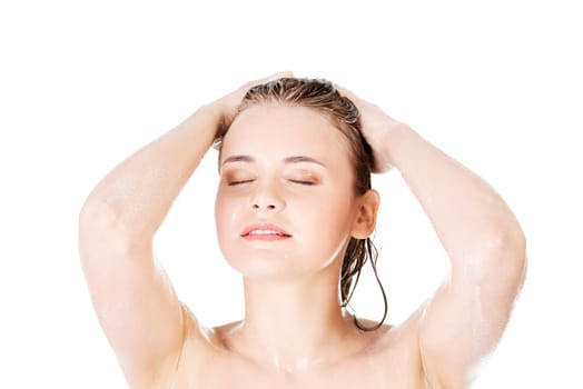 Young fit woman in shower washing her body