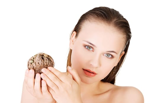 Beautiful spa woman holding Rose of Jericho