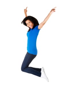 Young happy woman jumping in the air , isolated on white background
