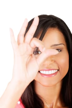 Beautiful young success woman giving perfect gesture standing on white background.