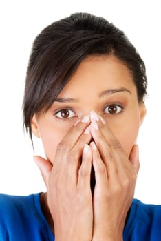 Young scared woman covering the mouth. Isolated on the white background.