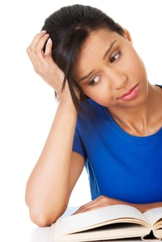 Woman studying at the desk being tired, isolated on white