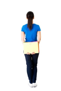 Back view of young student woman holding notebook.. Isolated over white background.