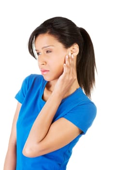 Young woman feeling a pain in ear,isolated on white background