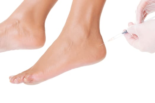 Woman getting an foot injection, isolated