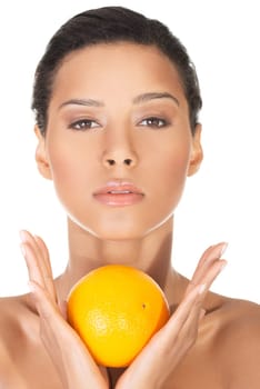 Young beautiful spa woman with orange in her hand, isolated on white