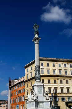 View in center, the Column of the Immaculate Conception, located in Rome, Italy, near the Piazza di Spagna.