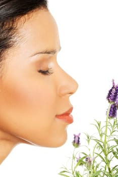 Beautiful girl smell purple lavender flowers