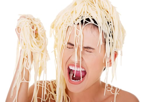 Young beautiful woman with spaghetti noodles on her hairs
