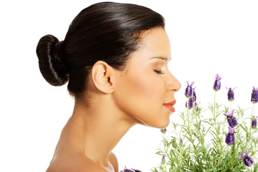 Beautiful girl smell purple lavender flowers