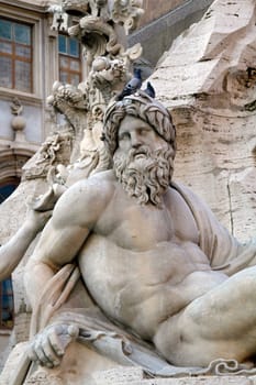 Close view details of the fountain of the four Rivers with Egyptian obelisk, located in the Piazza Navona, Rome, Italy.