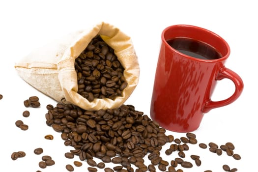 A bag of coffee beans and a red cup