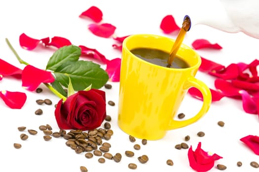 Coffee is poured from a pot into a cup